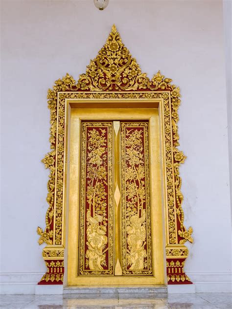 Golden Painted Door Frame Of The Temple In Thailand Stock Photo