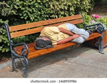 Homeless Man Sleeping On Park Bench Stock Photo Shutterstock