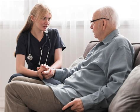 Free Photo Nurse Consoling Old Man In A Nursing Home