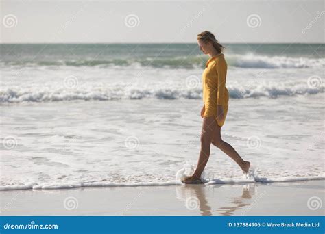 Woman Walking On The Beach Near Seashore Stock Photo Image Of
