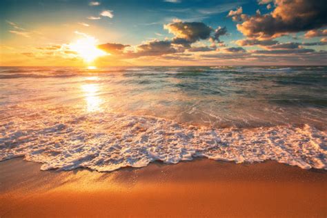 Beach Waves Sunset Stock Photos Pictures And Royalty Free Images Istock