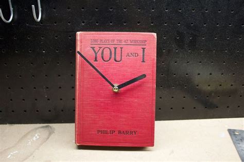 A Red Clock With The Words You And I Written On It Sitting On A Shelf