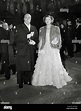 Myrna Loy and her husband, Gene Markey arriving outside the Empire ...