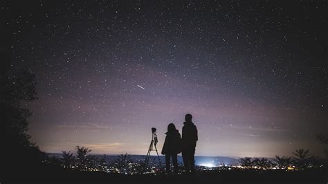 Silhouette Of Two Person Standing During Nighttime · Free Stock Photo