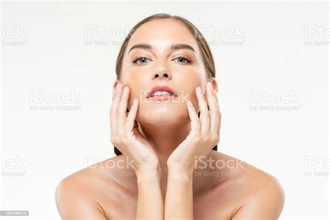 Beauty Shot Of Young Caucasian Woman With Clean Glowing Face Skin In