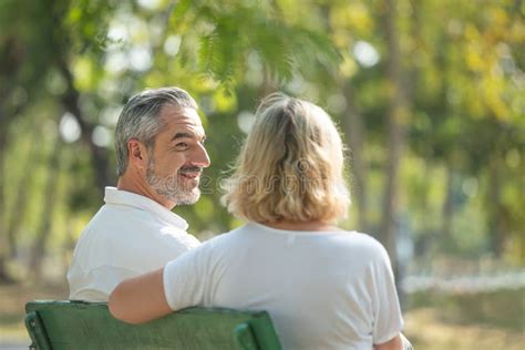 Elderly Man Woman Sitting Park Benches Stock Photos Free And Royalty