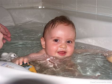 Baby Bathing In Tub