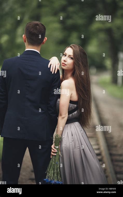 Loving Couple Boy And Girl Walking In The Beautiful Park Stock Photo
