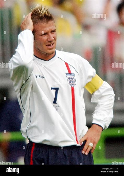 England Captain David Beckham Holds His Head As His Side Crash Out Of