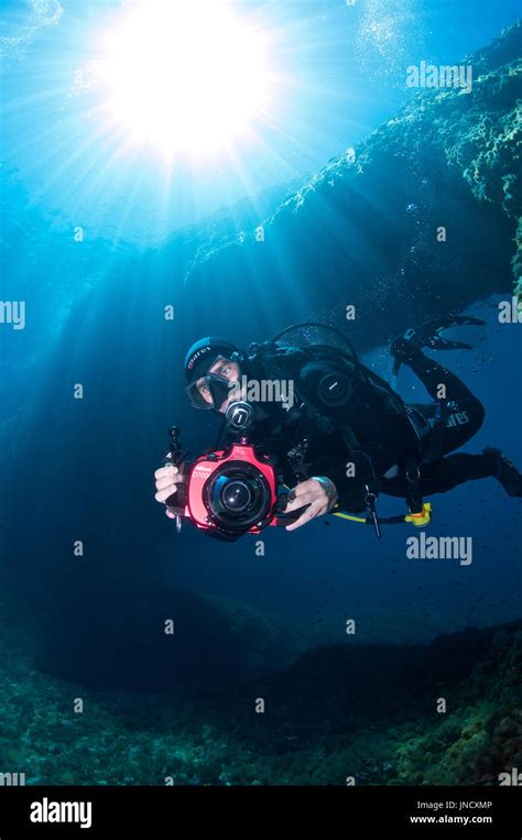 Underwater Photographer Scuba Diving At El Arco Dive Site In Ses
