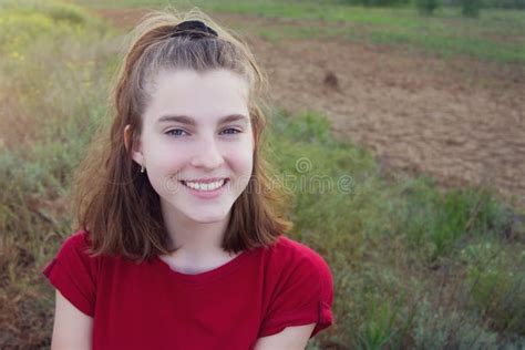 Portrait Of A Beautiful Young Teenage Girl With A Joyful Smile In The