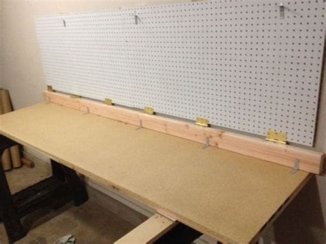 A Diy Wall Mounted Folding Workbench For A Great Diyer