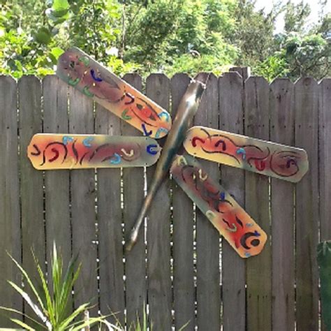 Maybe you would like to learn more about one of these? Upcycle ceiling fan blades into giant dragonflies | The Owner-Builder Network