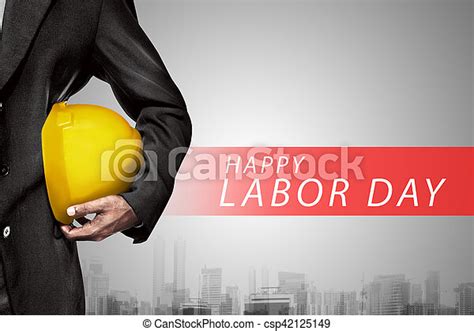Hand Or Arm Of Engineer Hold Yellow Plastic Helmet For Worker Labor