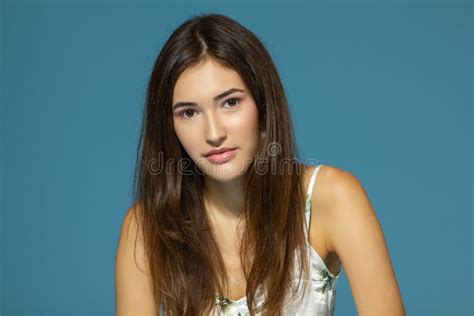 Beautiful Cheerful Teen Girl Looking At Camera Over Blue Background