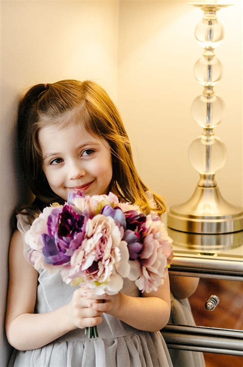 Shy Girl With Flowers By Stocksy Contributor Margaret Vincent Stocksy