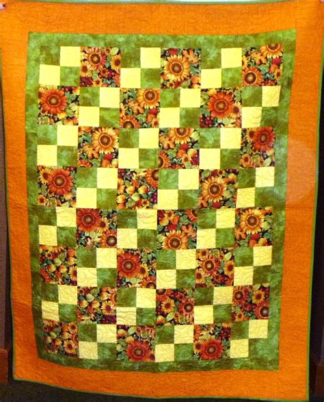 Sunflowers brighten this floating squares quilt. | Square quilt, Quilts, Brighten