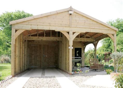 Tucked seamlessly into the landscape, the timber frame was designed to complement a pergola we built several years earlier in front of the garage. Car Ports | National Timber Buildings