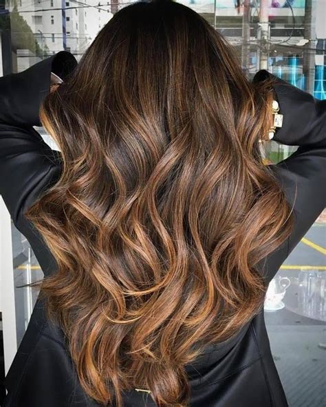 The lower part of the hair is cut short and remains brown. 50 Dark Brown Hair with Highlights Ideas for 2021 - Hair ...