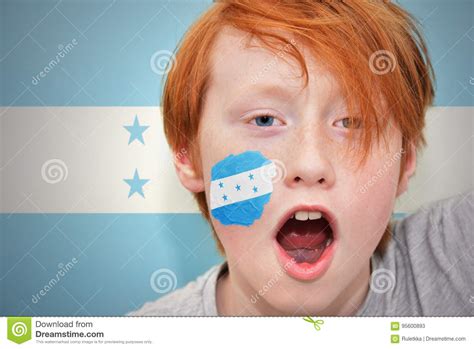 Redhead Fan Boy With Honduran Flag Painted On His Face Stock Image