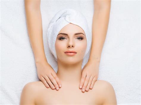 Young And Healthy Woman Gets Massage Treatments For Face Skin And Neck In The Spa Salon Health