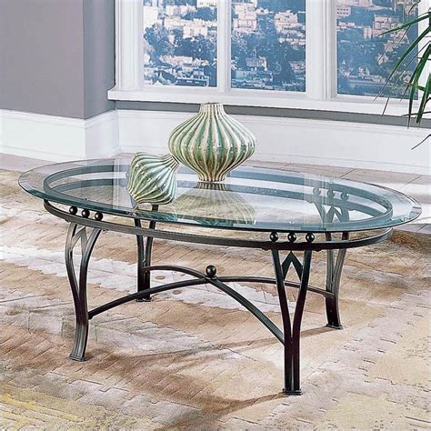 Amazon coffee table should always look refreshing, unique and elegant, as that is where you would sit for a fresh cup of coffee and feel rejuvenated. Steve Silver Company Madrid Glass Top Coffee Table - SR250CXB