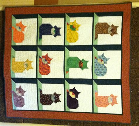 Welcome to our pattern selection! Cat in the Attic quilt