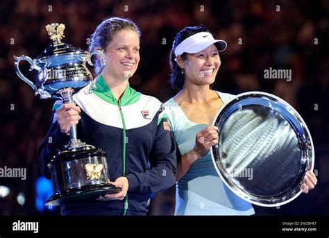 Belgiums Kim Clijsters Left Holds The Trophy Along With Runner Up