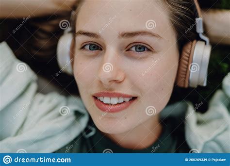 Portrait Of Young Woman Listening Music Trough Headphones Stock Image