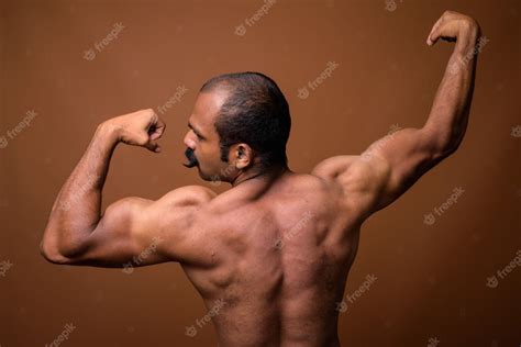 Premium Photo Rear View Of Muscular Indian Man With Mustache Shirtless