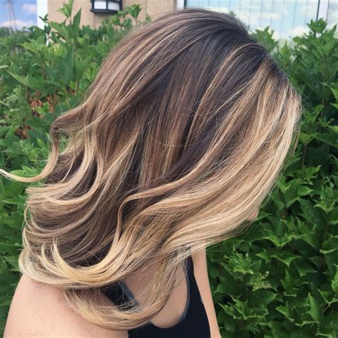 Balayage With Heavy Blonde Around The Face Blonde Highlights On Dark