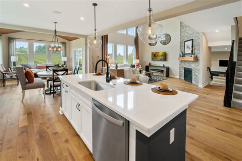 1 877 735 8556 designhelp@4lifeoutdoor.com Drees Homes Alden kitchen with white cabinets and contrasting island, stainless steel appliances ...