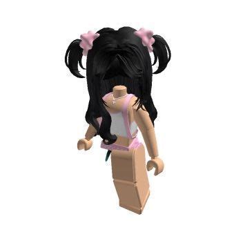 A Small Doll With Black Hair And Pink Bows On It S Head Is Standing In
