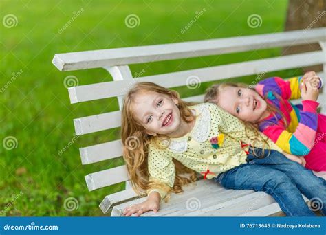 Two Beautiful Girlfriends Posing In The Garden Stock Image Image Of