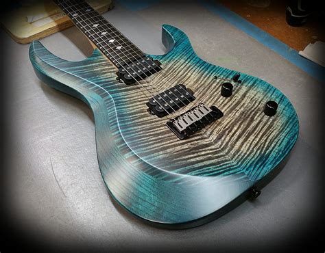 Kiesel A6 Aries Model Aqua Caliburst Over Flamed Maple Top With