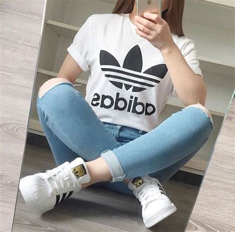 white adidas shirt knee ripped jeans white adidas superstars superstar outfit adidas shirt