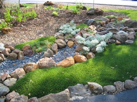 The standard mode of watering your lawn is a deep cycle watering, then a pause to allow it to dry out. Examples of Dry Creek Beds and Artificial Grass Lawns | Artificial Grass Installer | TuFFGrass