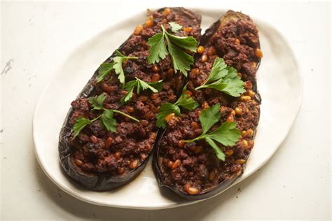 My husband is middle eastern and he said this was tasty i had some boneless leg of lamb steaks that the butcher cut too thin. Stuffed Eggplant with Ground Lamb and Pine Nuts | Fine ...