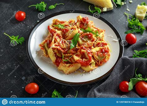 Spinach Ricotta Ravioli In Tomato Sauce With Wild Rocket And Parmesan Cheese Stock Photo Image