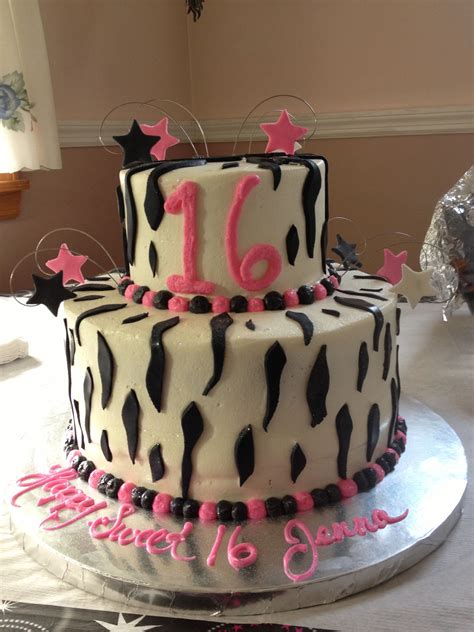 A Birthday Cake With Pink And Black Decorations