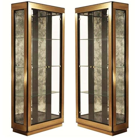Cymax carries curio cabinets from all the majof furniture brands including howard miller curio cabinets and pulaski curio. Two Modern Black Lacquered Brass Curio Display Cabinets by ...