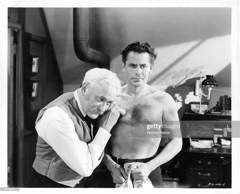 Glenn Ford Gets Checked Out By A Doctor In A Scene From The Film The