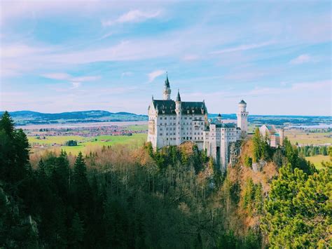 Castle Above Hill Surrounded By Trees Photo Free Castle Image On Unsplash