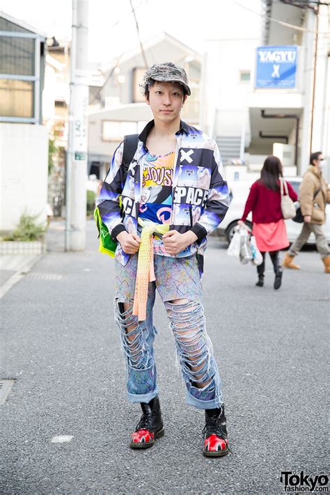 Safety Pins Hat Comic Tee And Torn Jeans And Neon Backpack In Harajuku