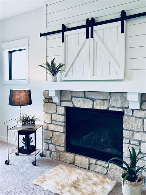 Barn Doors Are A Great Choice For Hiding Tvs Above The Fireplace