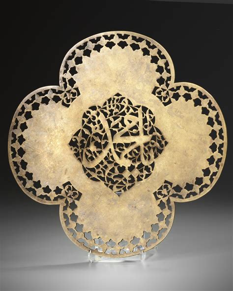 an elegant safavid pierced steel quatrefoil panel persia 17th century