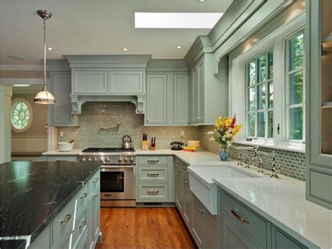 Kitchen features a plank ceiling over sage green cabinets with brass pulls, sage green wooden kitchen hood over white marble slab backsplash waterworks blue note wall mounted single arm sconces illuminate a transitional green powder room featuring a sage green washstand topped with. Spectacular Overwhelming Green Kitchen Cabinets With Black ...