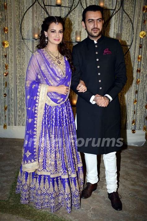 dia mirza and sahil sangha poses for the media at their sangeet ceremony media