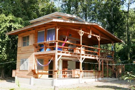 Outer walls concrete/brick/stone wood half. Half Cement Half Amakan House - Modern House