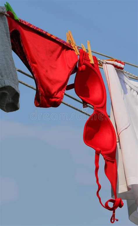 Big Red Bra And Panties Hung Out To Dry In The Sun Outside Stock Photo